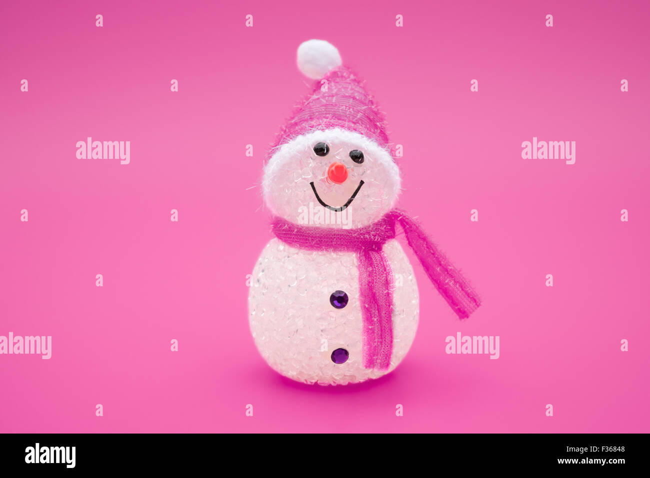 smiling toy christmas snowman on a red background Stock Photo