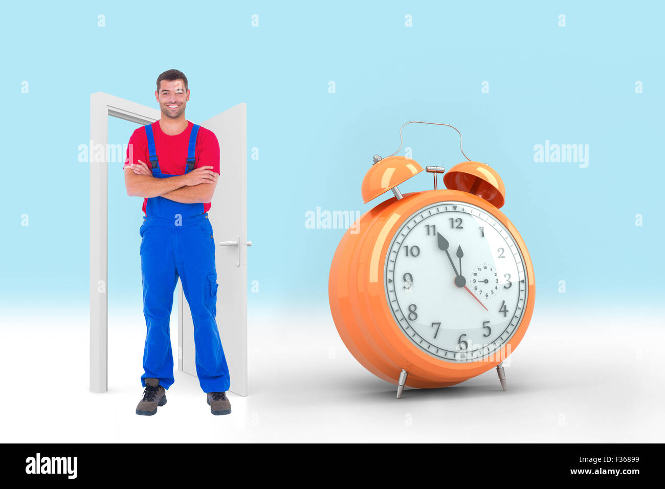 Composite image of handyman in overalls standing arms crossed over white backgound Stock Photo