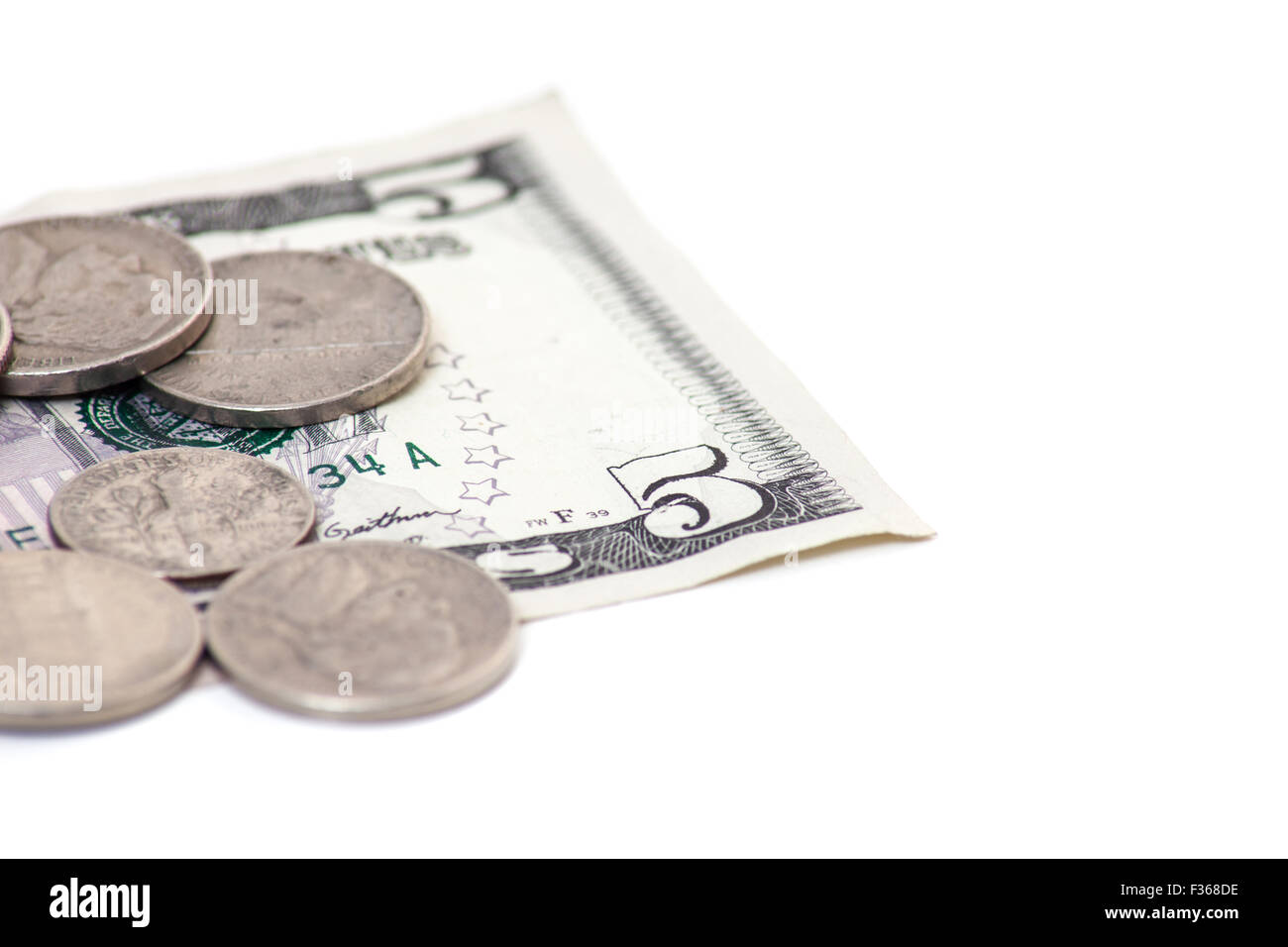 Spare change. All on white background Stock Photo - Alamy