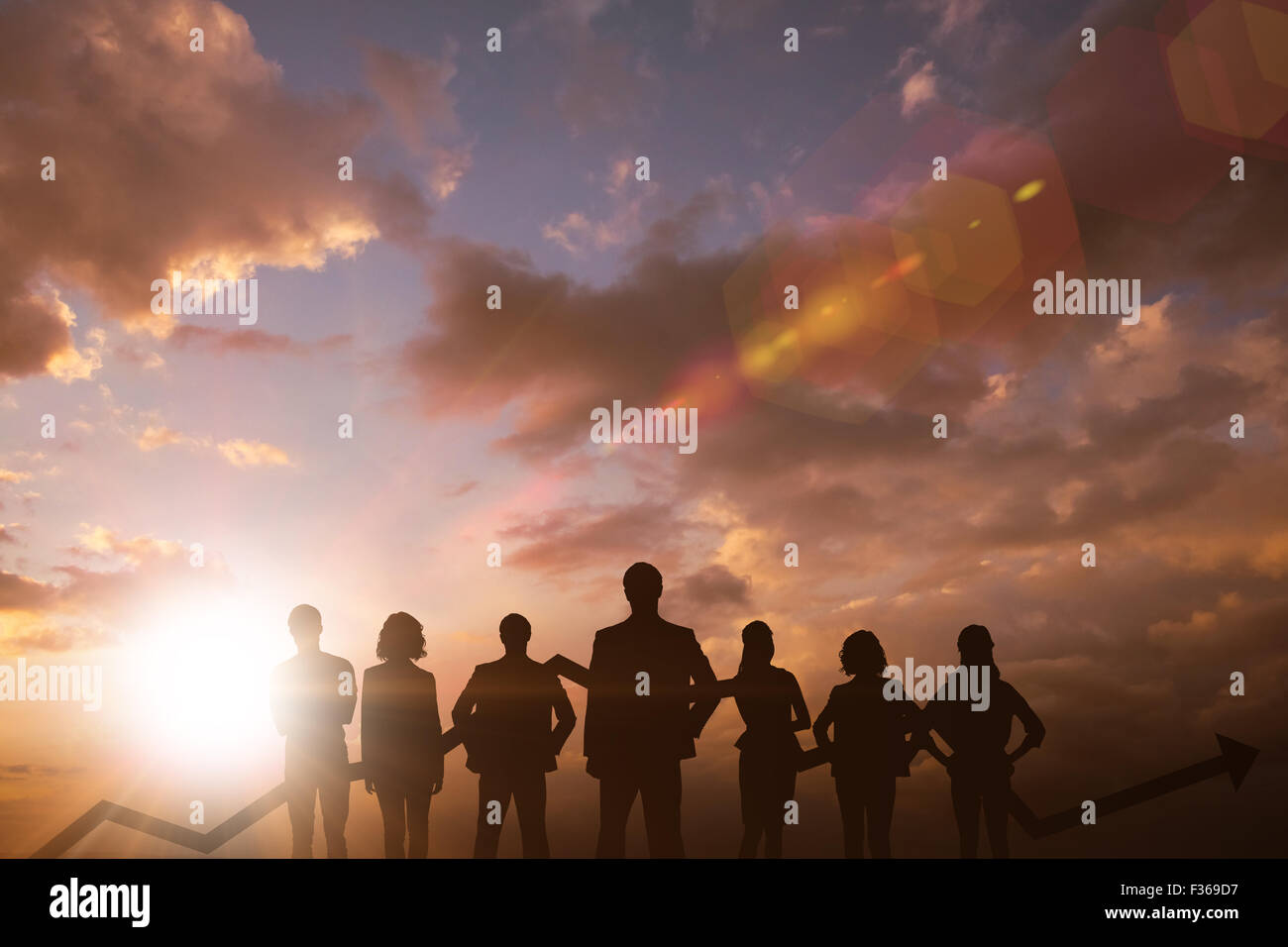 Composite image of business team with arrow Stock Photo - Alamy