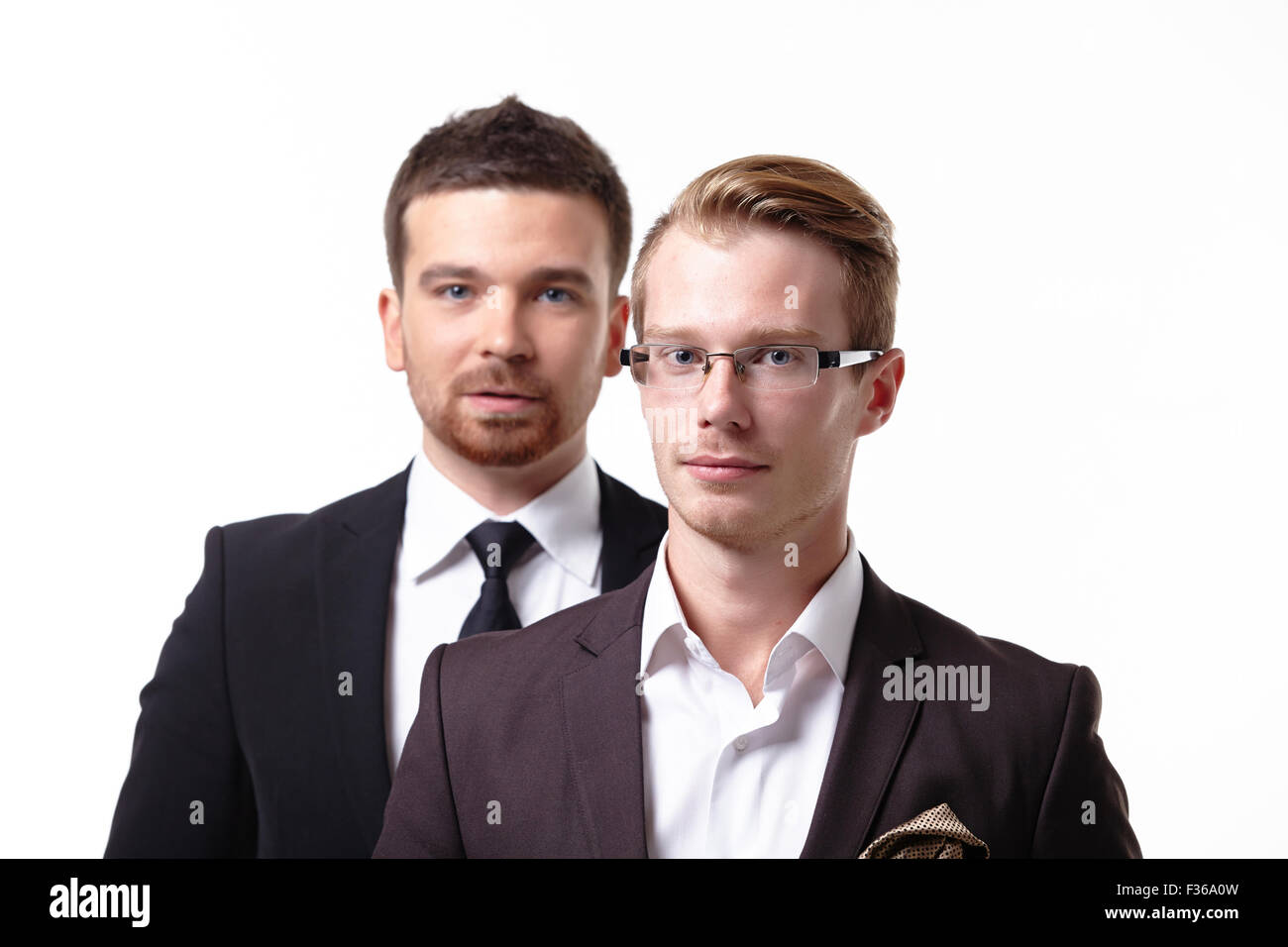 close-up portrait of two young businessmen Stock Photo - Alamy