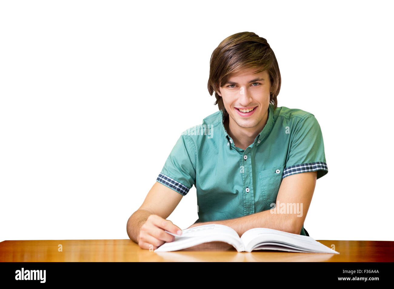 Student sitting in library reading Stock Photo