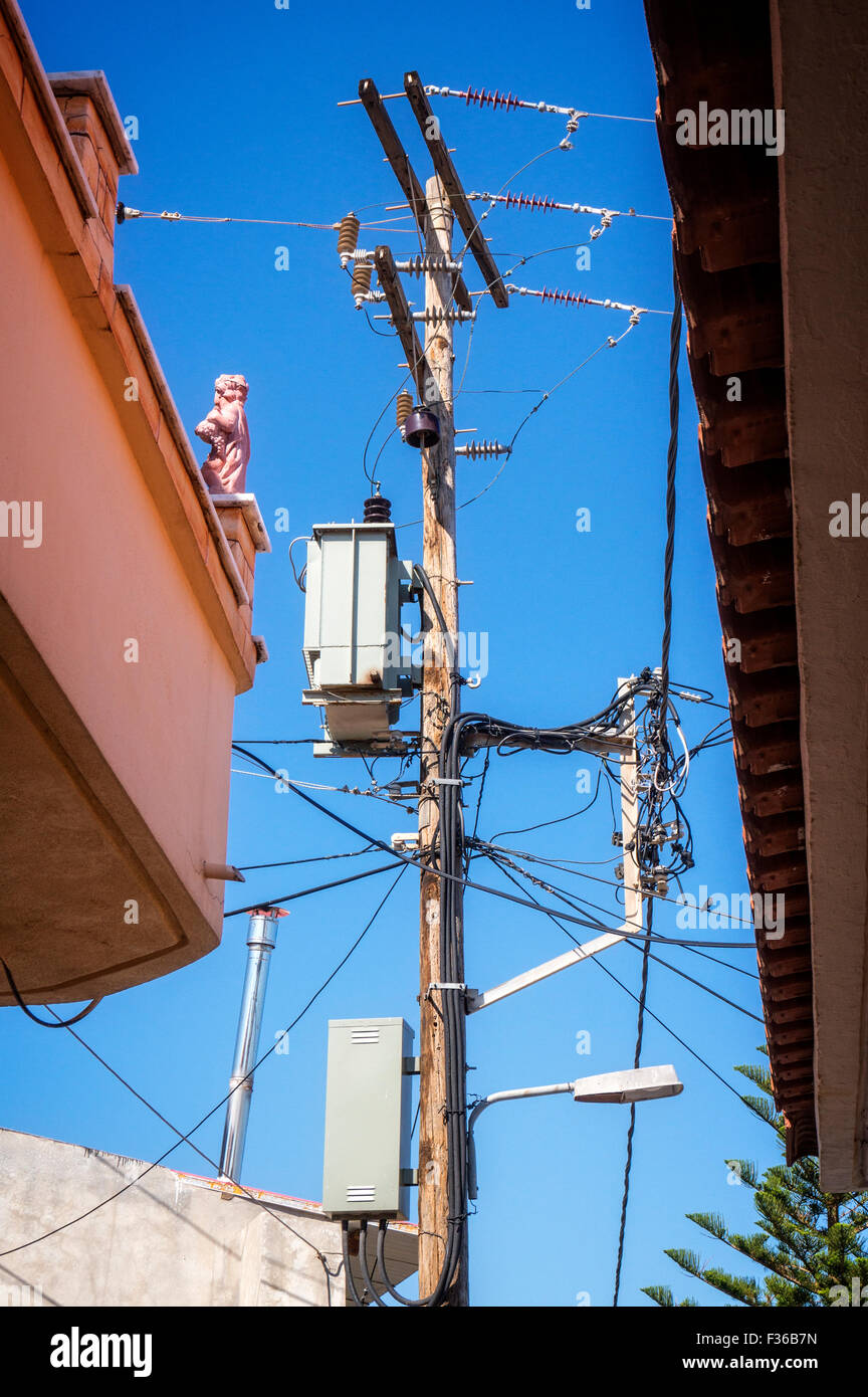 Power pole in a village on the Greek island of Crete. Stock Photo