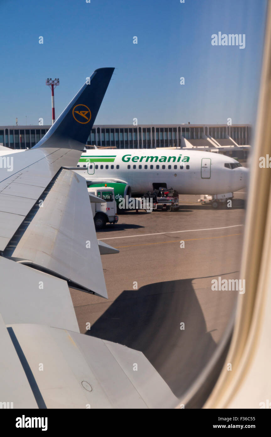 An aircraft of the airline Germania at the airport Heraklion in Crete. Seen from the cab of a Condor Jet. Stock Photo