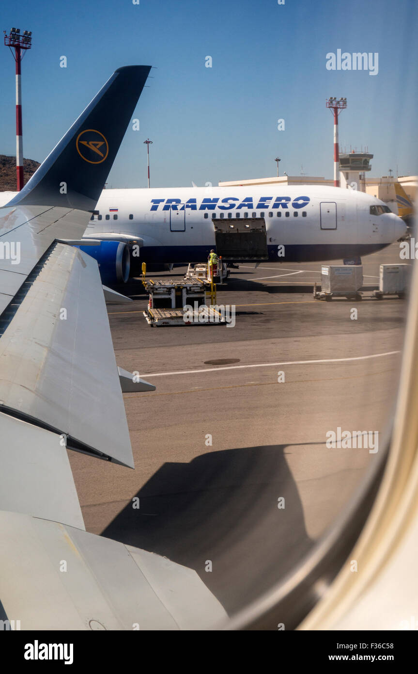 An aircraft of the airline Transaero at the airport Heraklion in Crete. Seen from the cab of a Condor Jet. Stock Photo