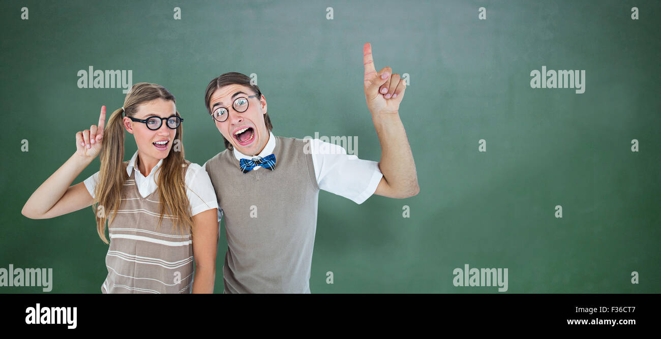 Composite image of geeky hipsters pointing Stock Photo
