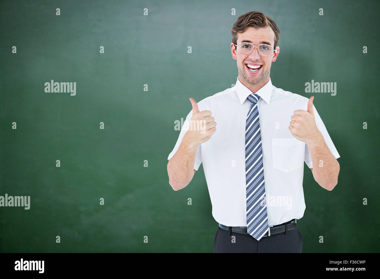 Composite image of happy geeky businessman with thumbs up Stock Photo ...
