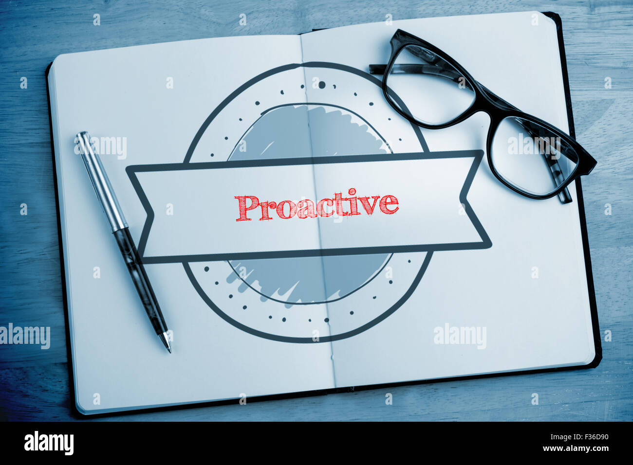 Proactive against overhead of open notebook with pen and glasses Stock Photo