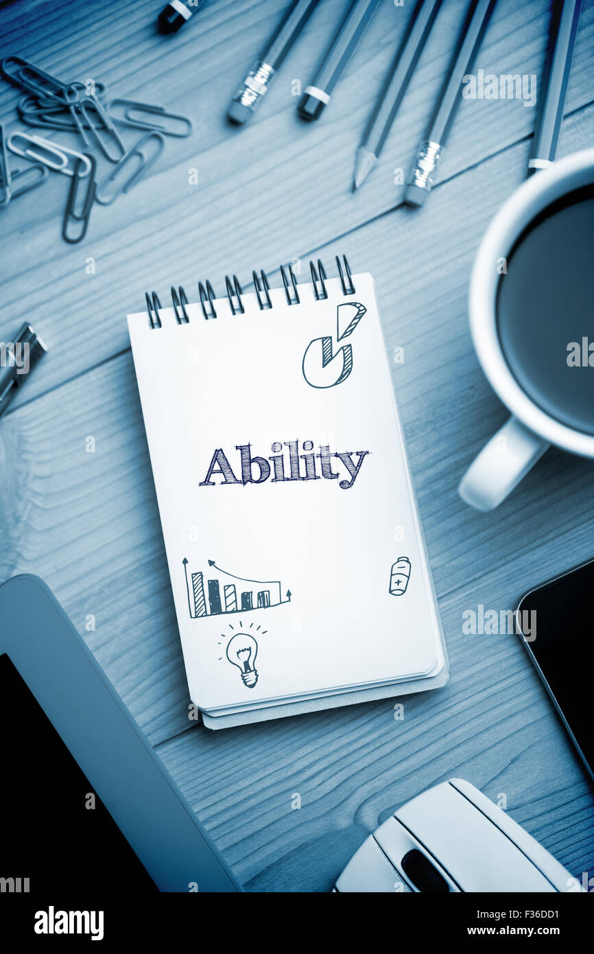 Ability  against notepad on desk Stock Photo
