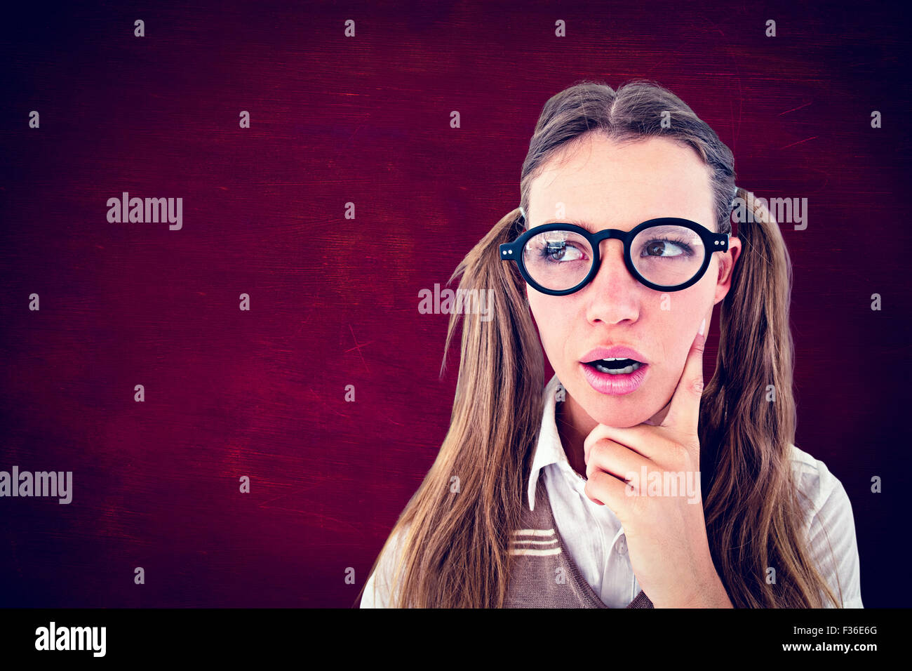 Composite image of female geeky hipster looking confused Stock Photo