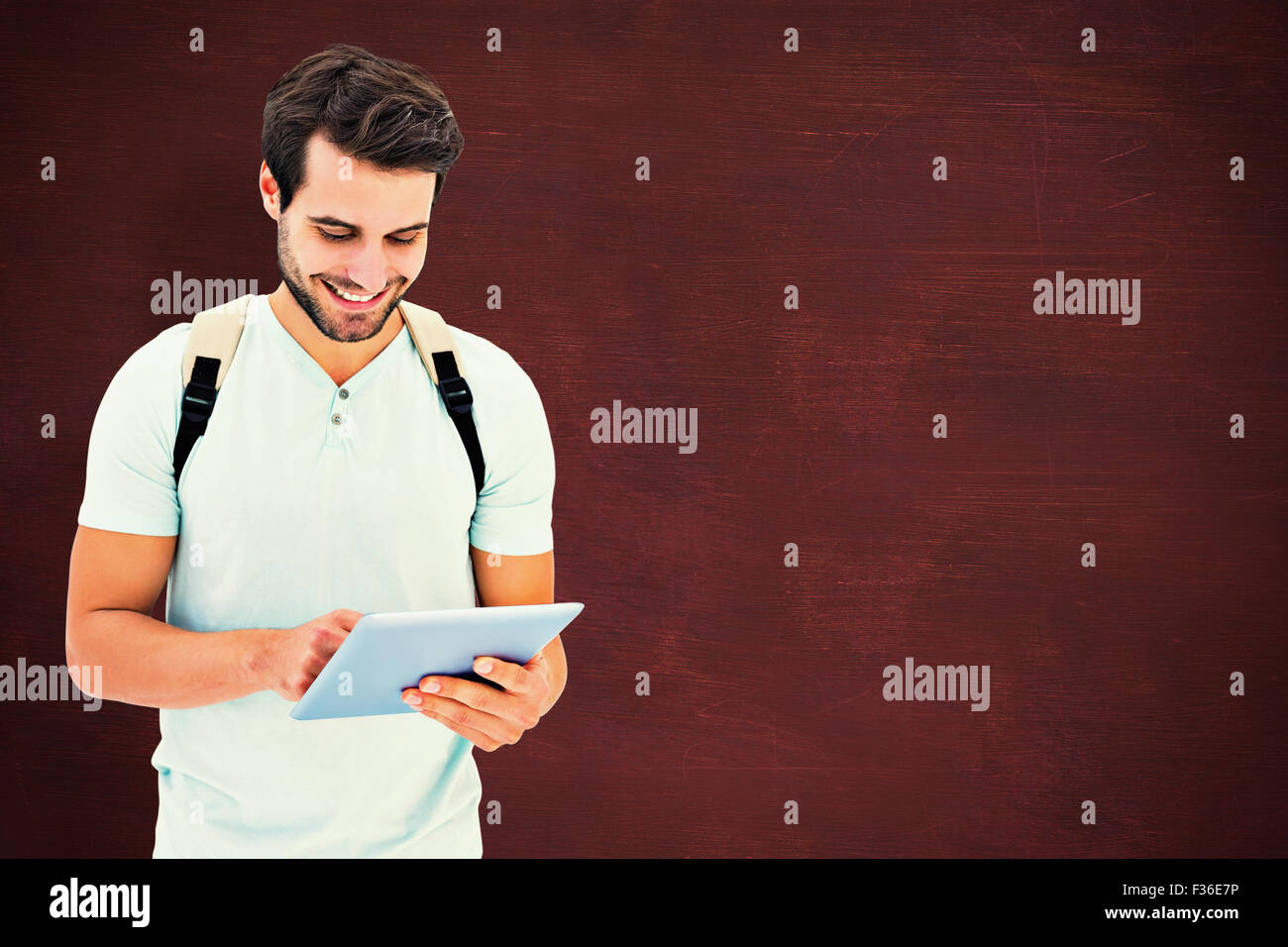Composite image of student using tablet pc Stock Photo