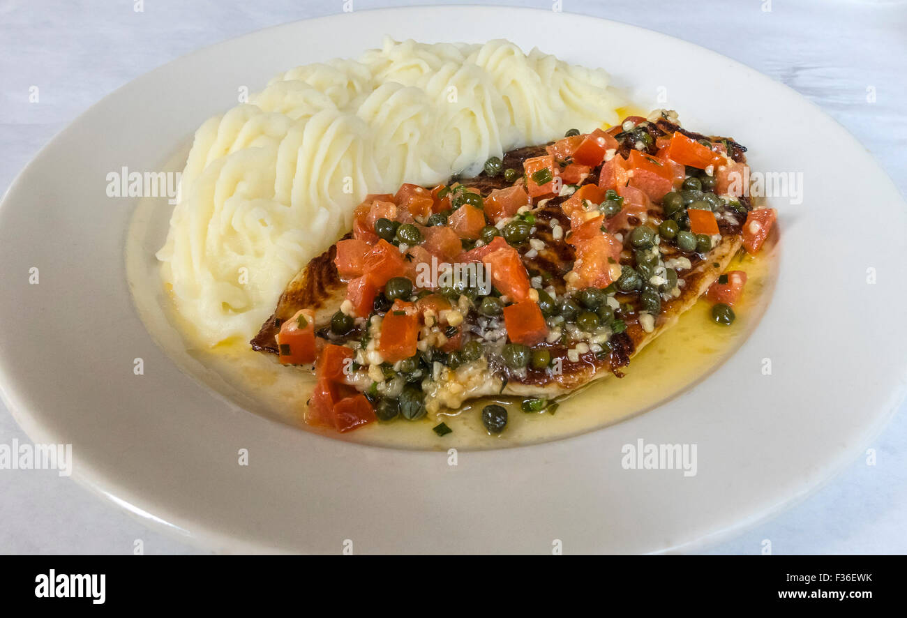 Grilled Tilapia with a sauce of tomato, capers, butter and quinoa and