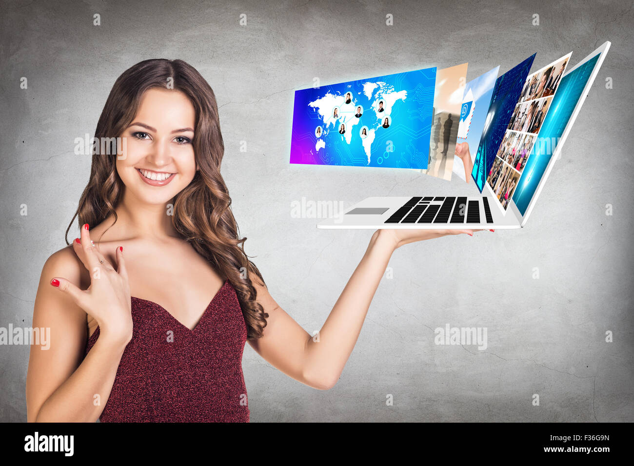 Young woman holds laptop Stock Photo