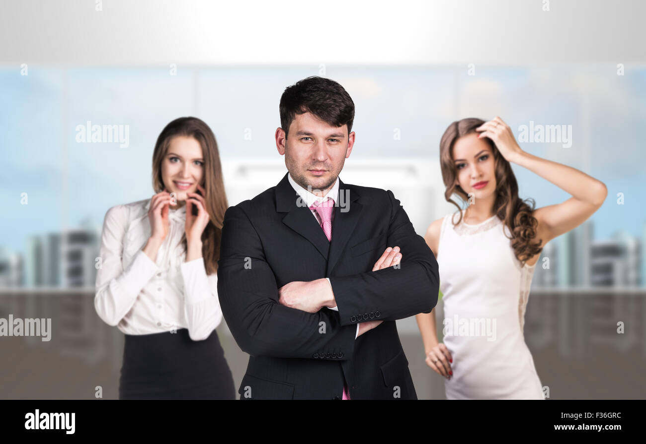 Several business people stand in the hall Stock Photo - Alamy