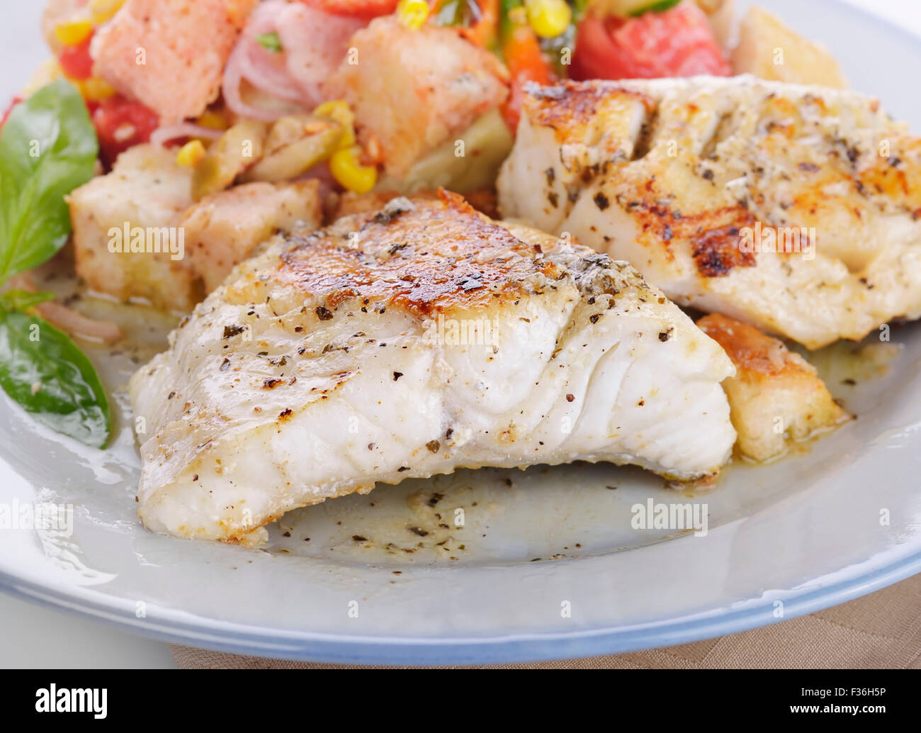 Seared Mahi Mahi Fillets with Vegetables and Sauce Stock Photo Alamy