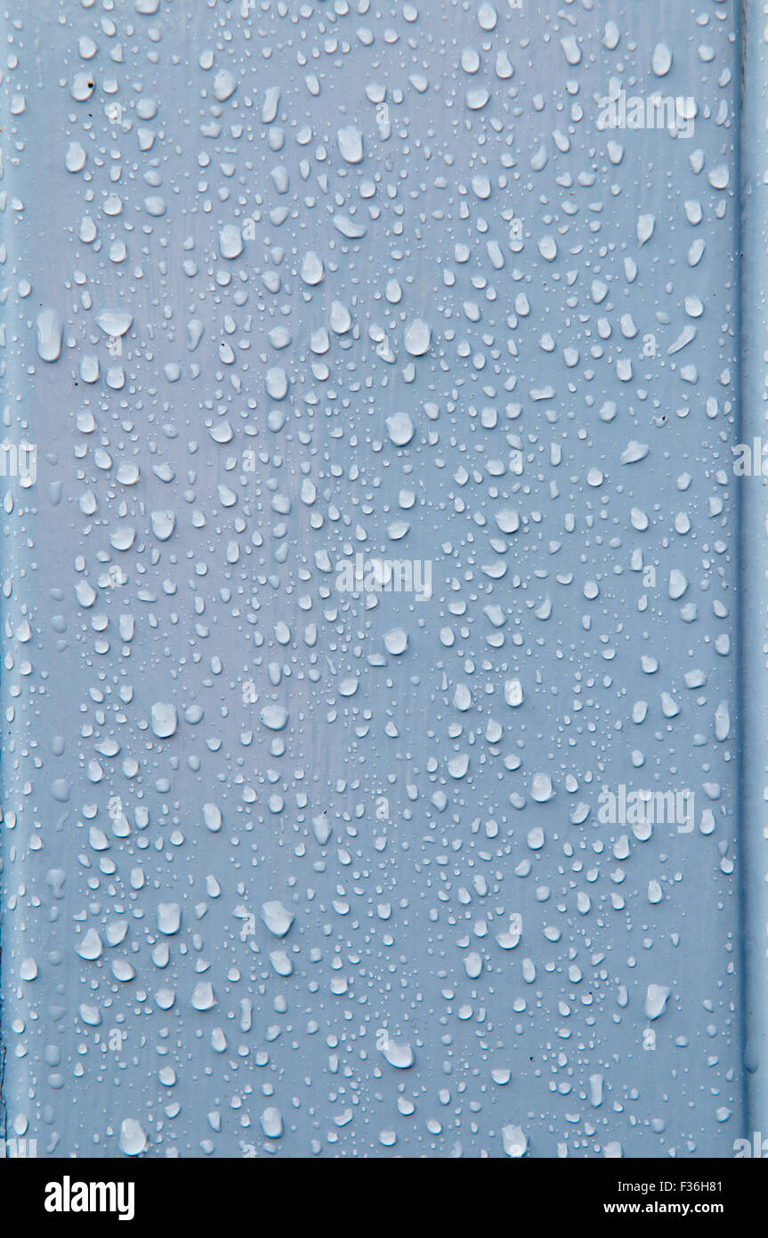 Water droplets on a smooth blue surface Stock Photo - Alamy