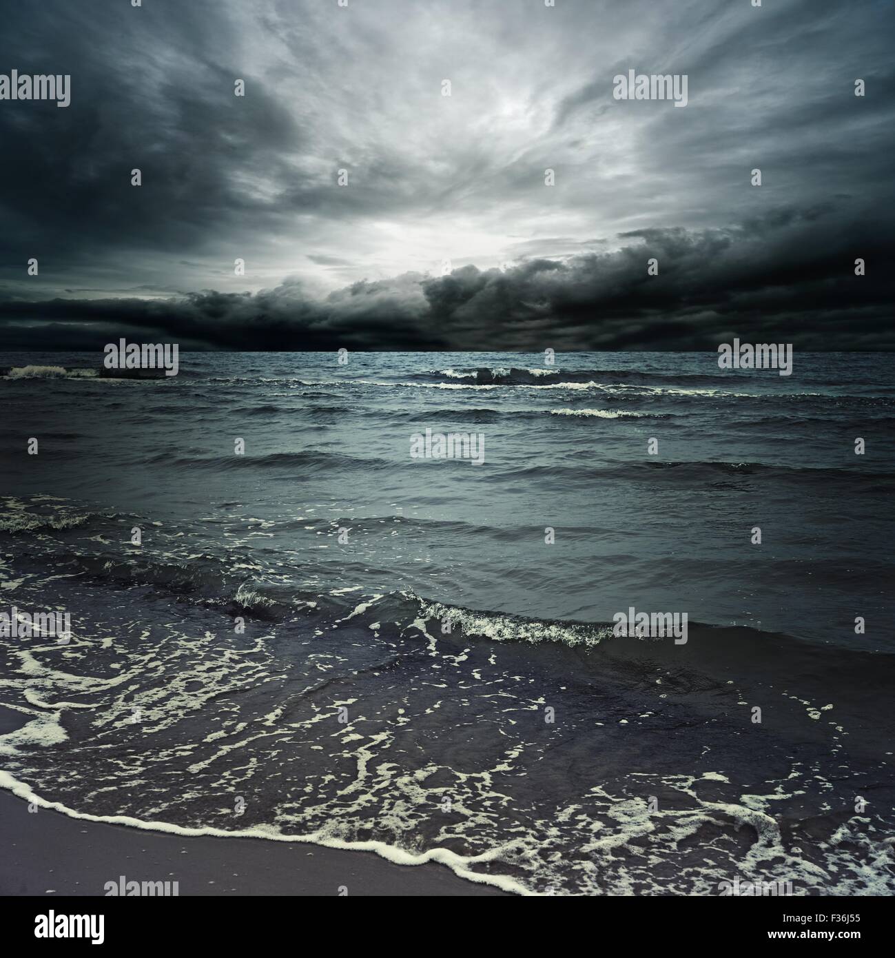 Stormy clouds over dark ocean Stock Photo - Alamy