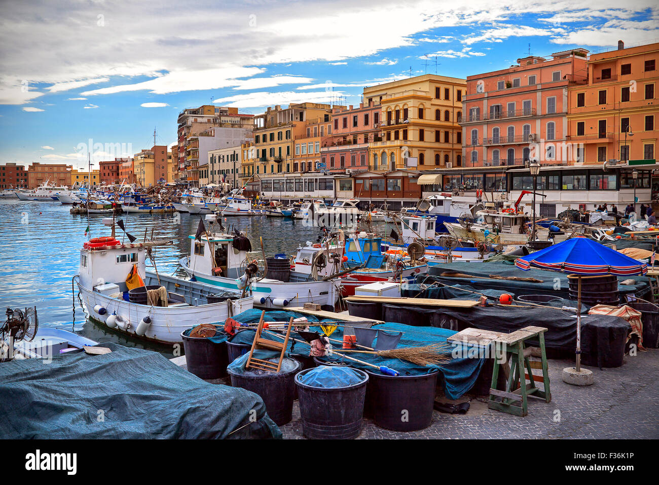 The quay of the port of Anzio, with the fishing boats and fishing nets. Stock Photo