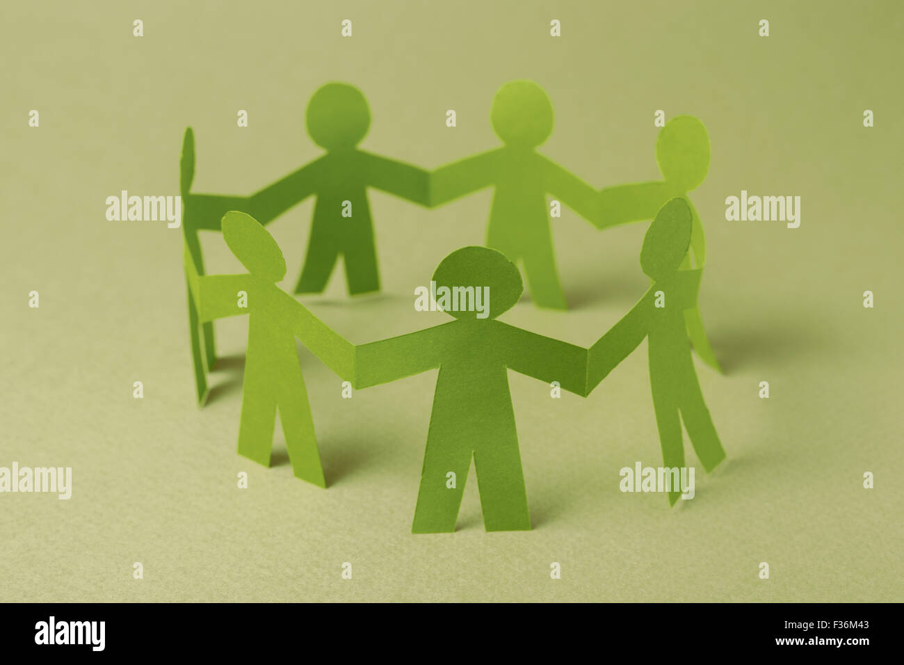 Group of paper doll holding hands Stock Photo Alamy