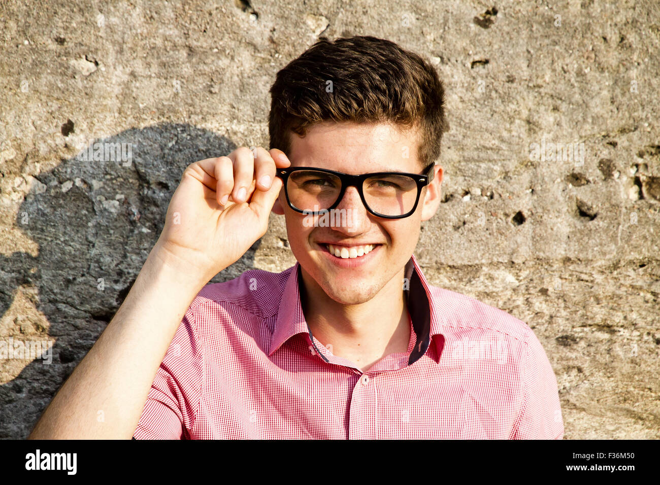 Portrait of young friendly man with glasses Stock Photo