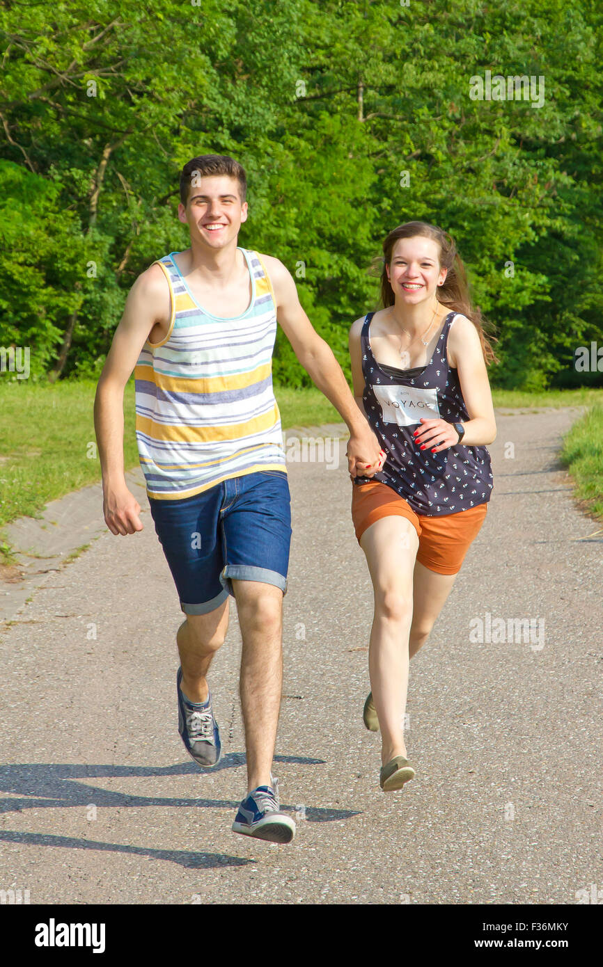 Young love couple running together Stock Photo