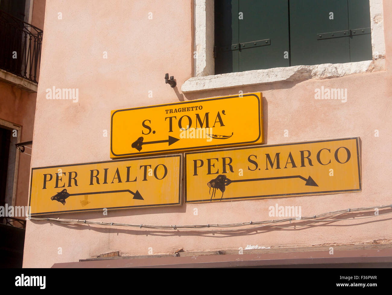 Street signs directions to Rialto, San MArco and traghetto stop Venice Veneto Italy Stock Photo