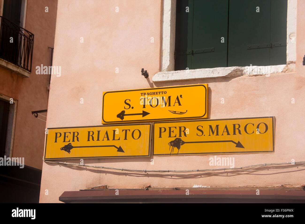 Street signs with directions to traghetto stop, Rialto and San Marco Venice Veneto Italy Stock Photo