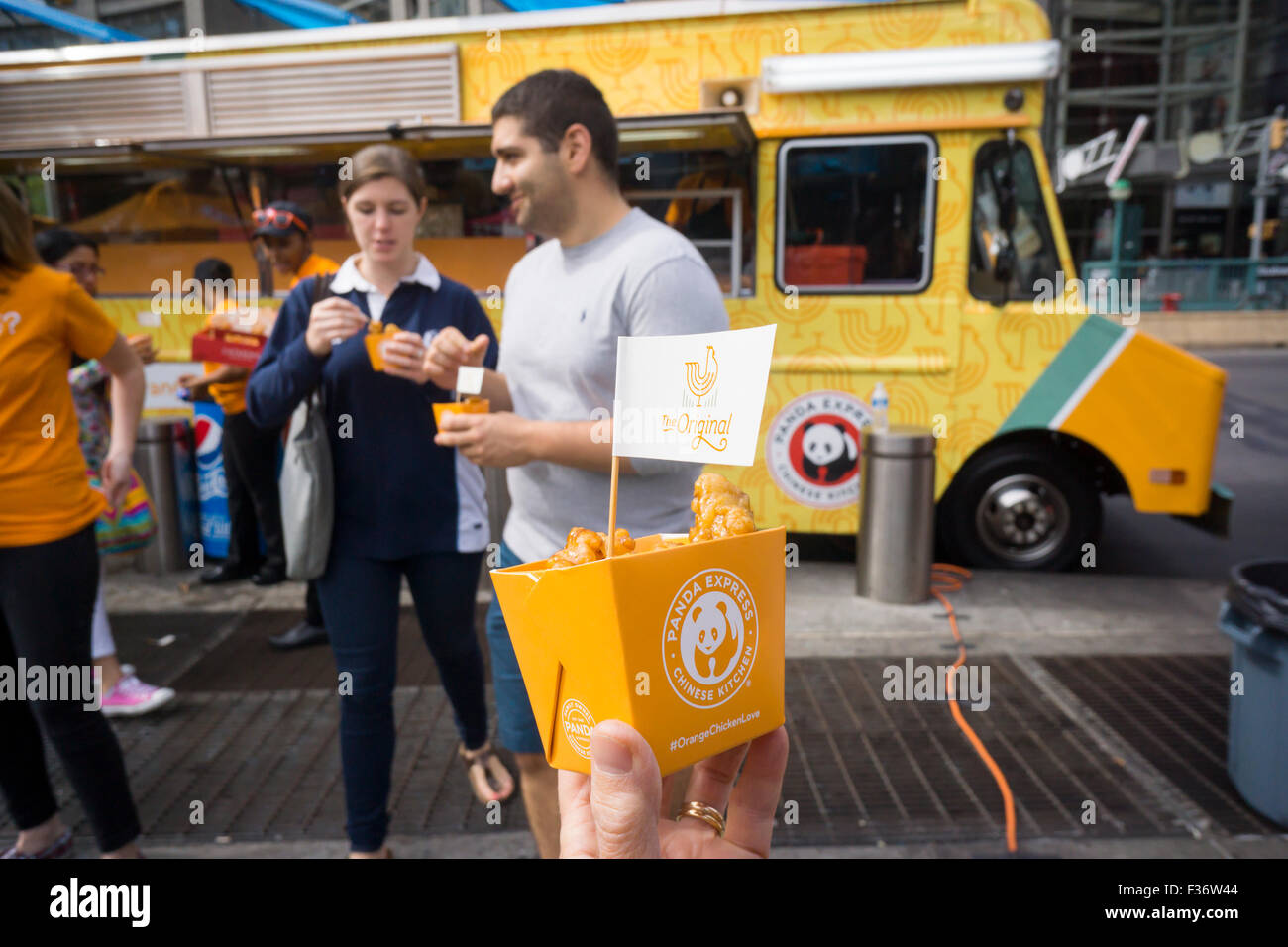 Hundreds eat samples of Panda Express' signature Orange Chicken at ...