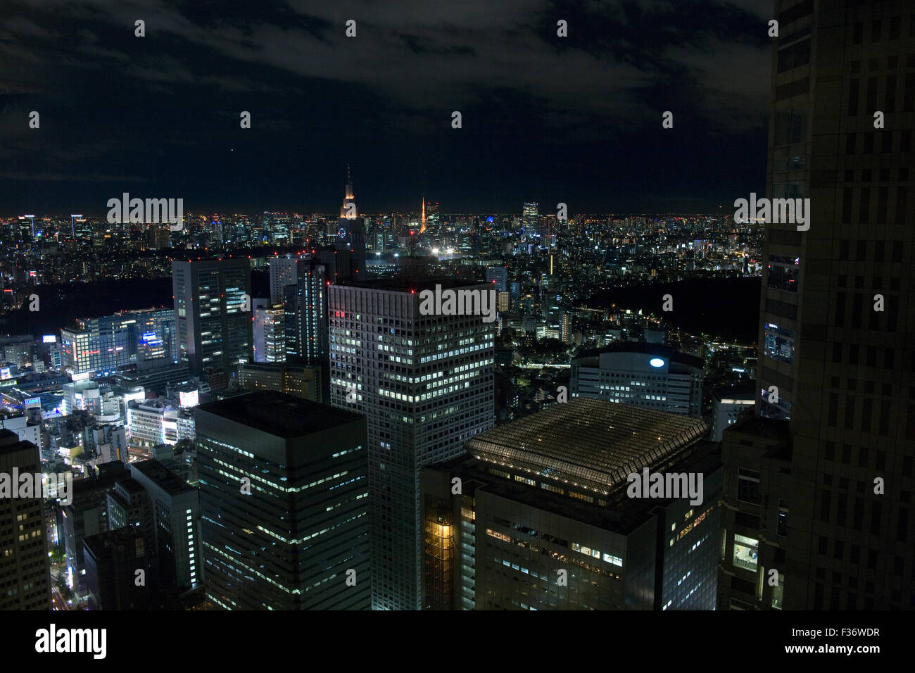 Night city scape seen from above office buildings in Tokyo, Japan Stock Photo