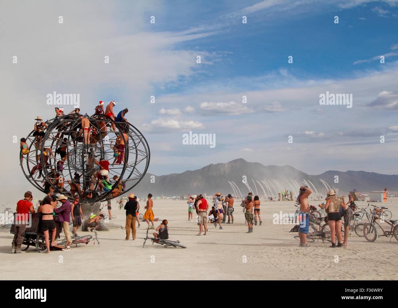 Burners gather in the playa during the annual Burning Man festival in the desert August 30, 2014 in Black Rock City, Nevada. Stock Photo