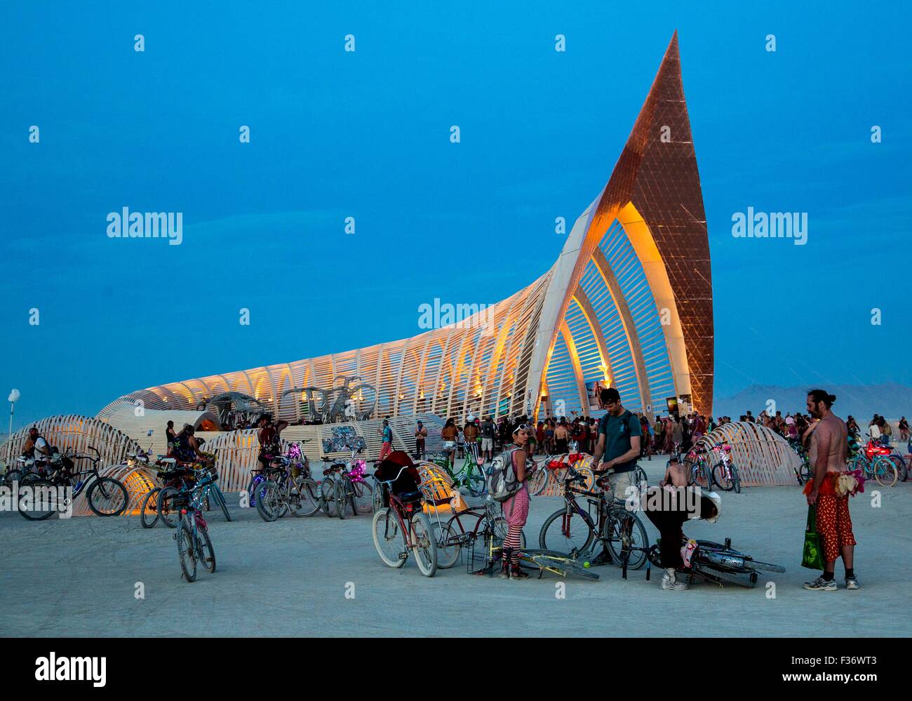 Burner bikes and art cars cruise the playa during the annual Burning Man festival in the desert August 29, 2012 in Black Rock City, Nevada. Stock Photo