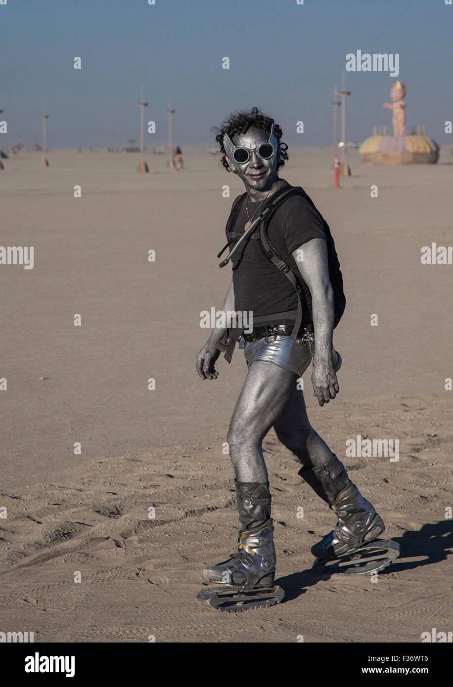 A Burner dressed as an alien in the playa during the annual Burning Man festival in the desert September 2, 2012 in Black Rock City, Nevada. Stock Photo