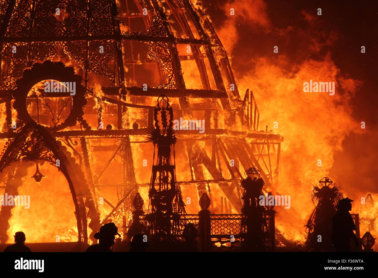 The Burning Man goes up in flames on the final night in the playa during the annual Burning Man festival in the desert August 31, 2014 in Black Rock City, Nevada. Stock Photo
