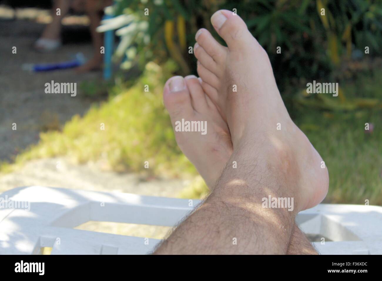 feet of man at relaxation Stock Photo