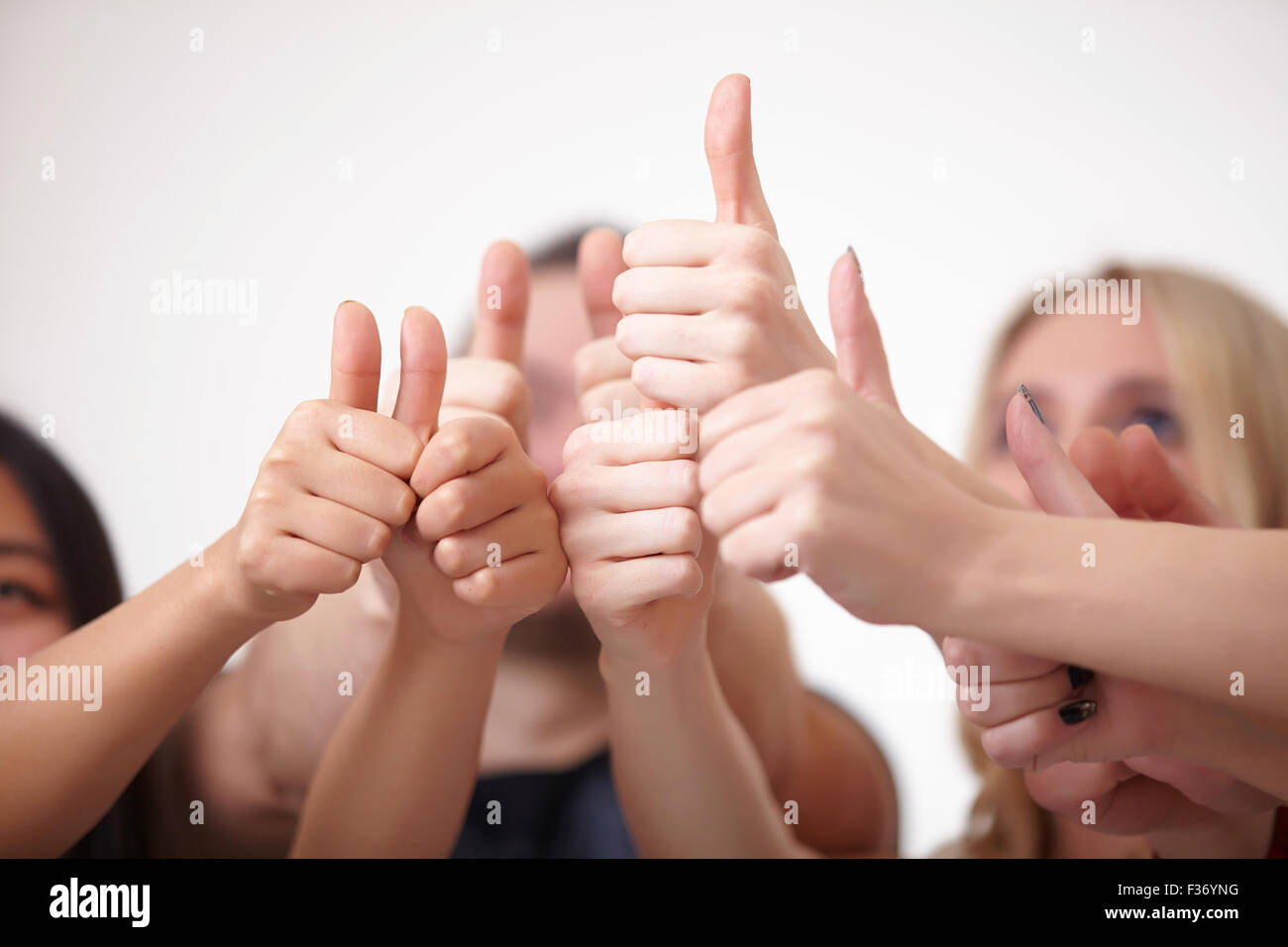 a group of young people, students stand together, show the thumb Stock Photo
