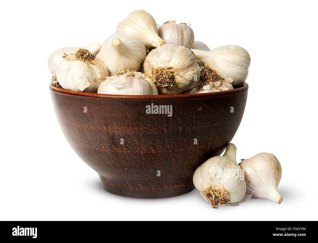 Whole head of garlic in ceramic bowl isolated on white background Stock Photo