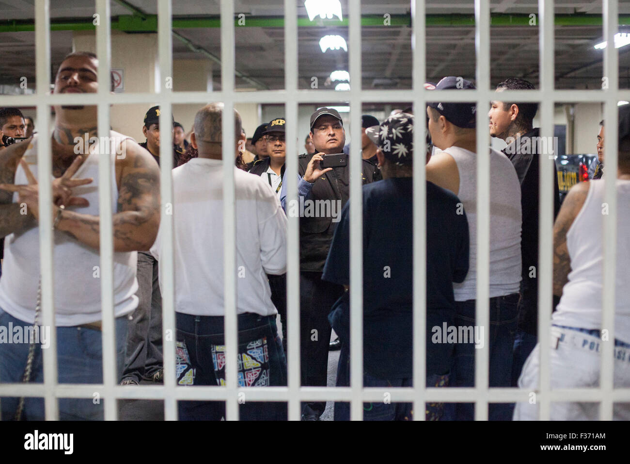 Guatemala City, Guatemala. 30th Sep, 2015. Gangsters keep under custody in the Tower of Courts, in Guatemala City, capital of Guatemala, Sept. 30, 2015. A gang member was killed and two others wounded by rival gangsters of Barrio 18 and Mara Salvatrucha while they were held under custody in the Tower of Courts basement, located in the Civic Center of the Guatemalan capital, according to local press information. Credit:  Luis Echeverria/Xinhua/Alamy Live News Stock Photo