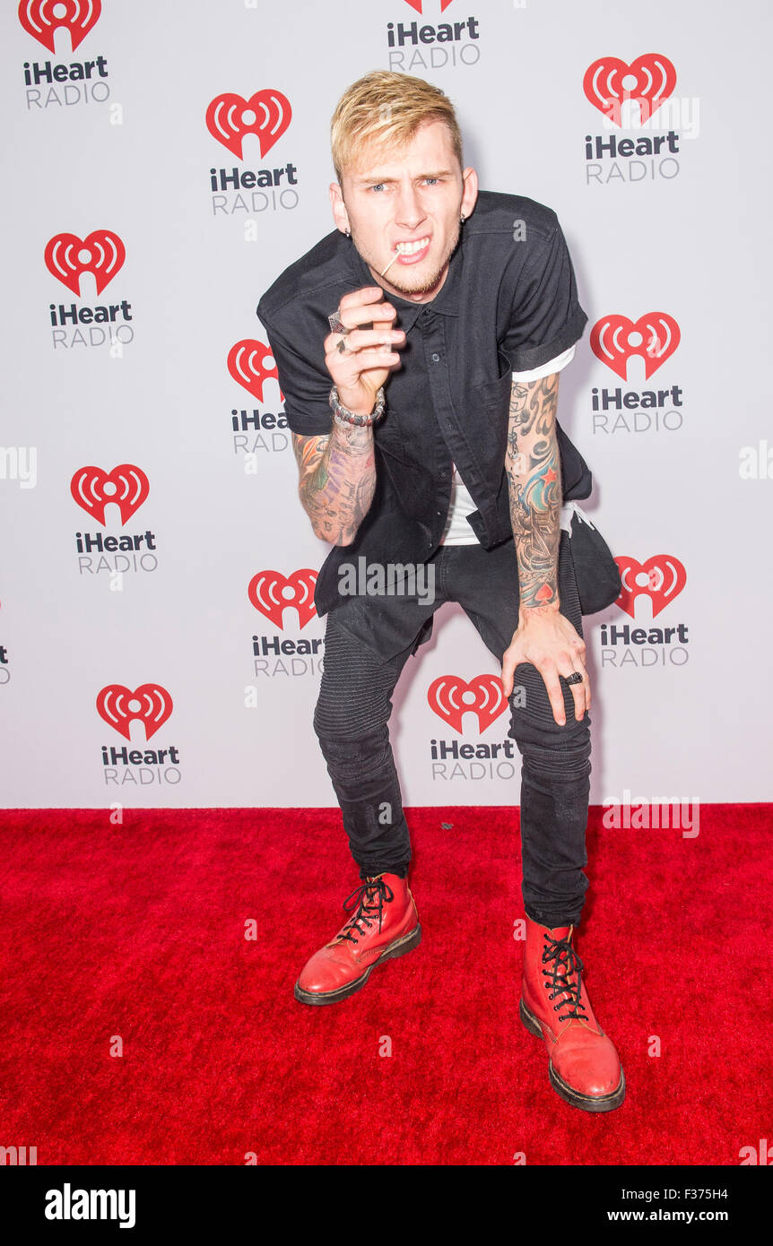 Rapper Machine Gun Kelly attends the 2015 iHeartRadio Music Festival at