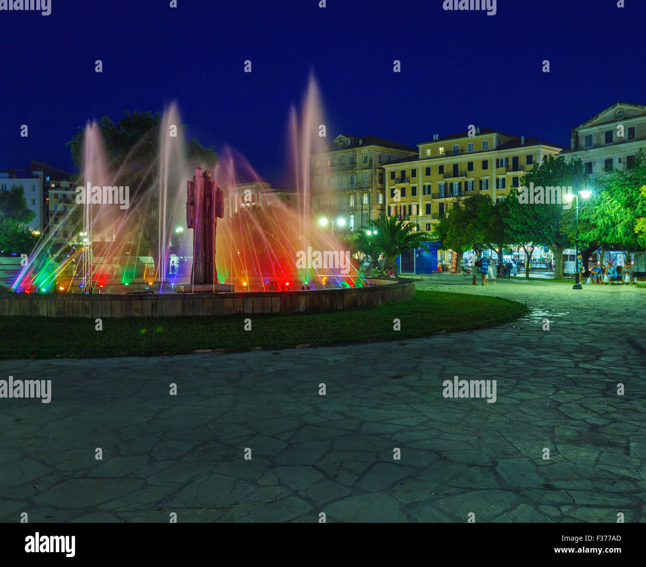 Colored water fountain at night, Corfu city Stock Photo - Alamy