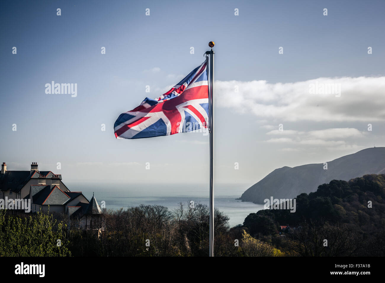 Union jack flag blowing in the wind on the English coast Stock Photo