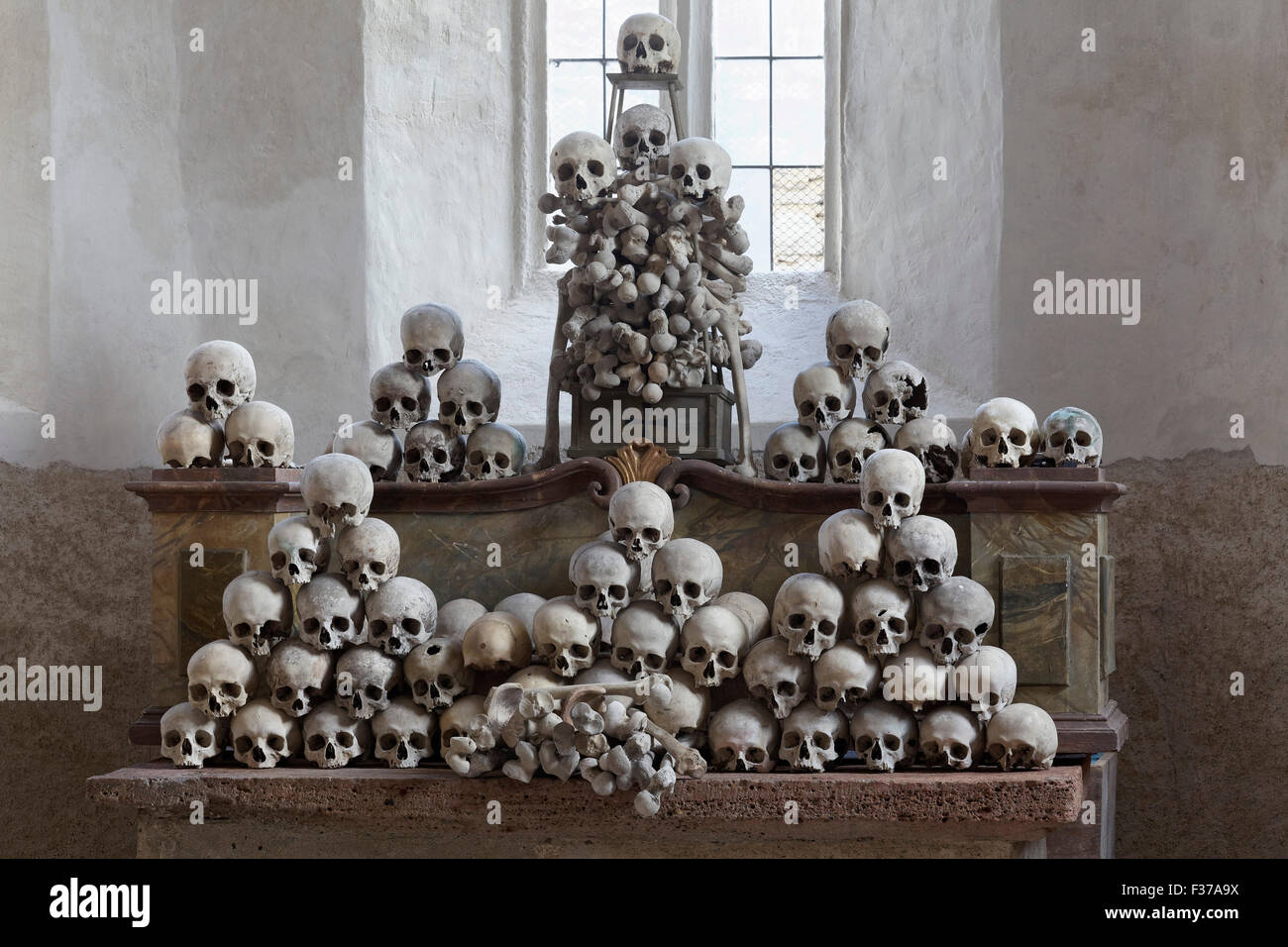 Altar with skull and bones, Schädelpietà, Ossuary or charnel house of the fortified church St. Michael, Weißenkirchen, Wachau Stock Photo