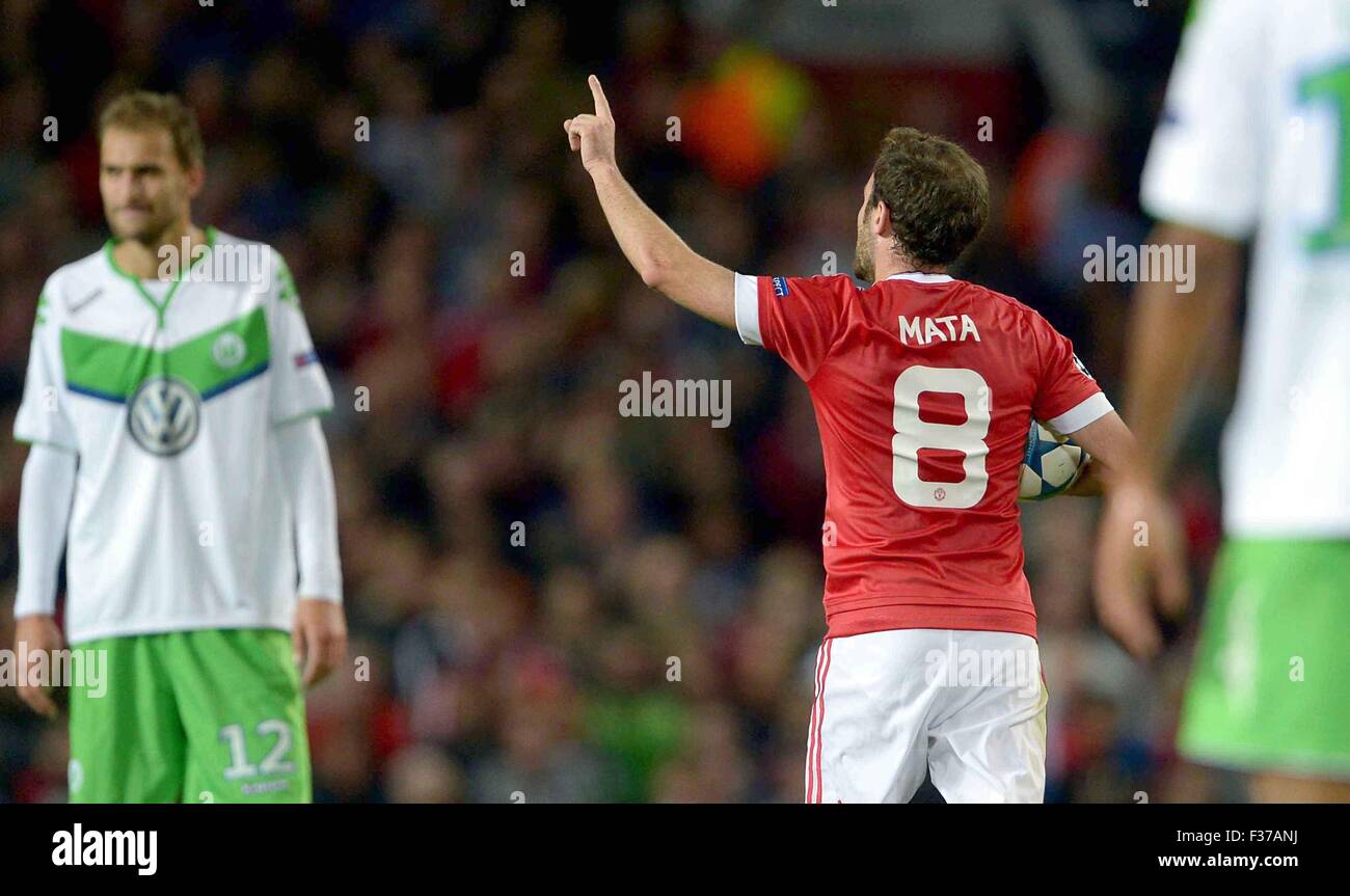 Manchester, Great Britain. 30th Sep, 2015. Manchester United's Juan Manuel Mata (C-R) celebrates his 1-1 equaliser during the UEFA Champions League Group B first leg soccer match between Manchester United and VfL Wolfsburg at the Old Trafford in Manchester, Great Britain, 30 September 2015. Photo: Peter Steffen/dpa/Alamy Live News Stock Photo