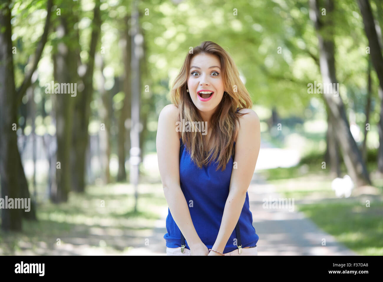 beautiful girl in a park smiling Stock Photo - Alamy