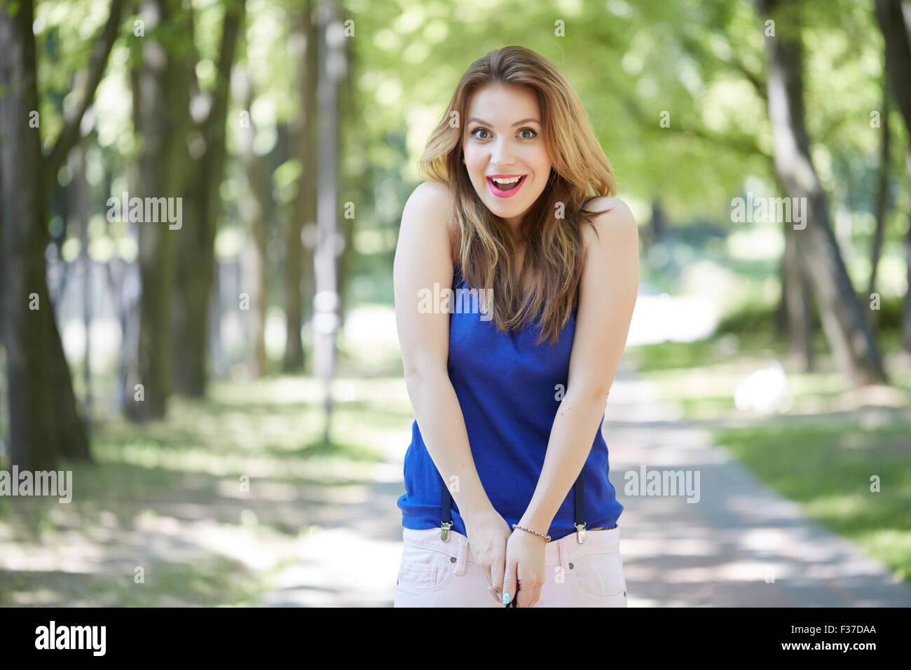 beautiful girl in a park smiling Stock Photo - Alamy