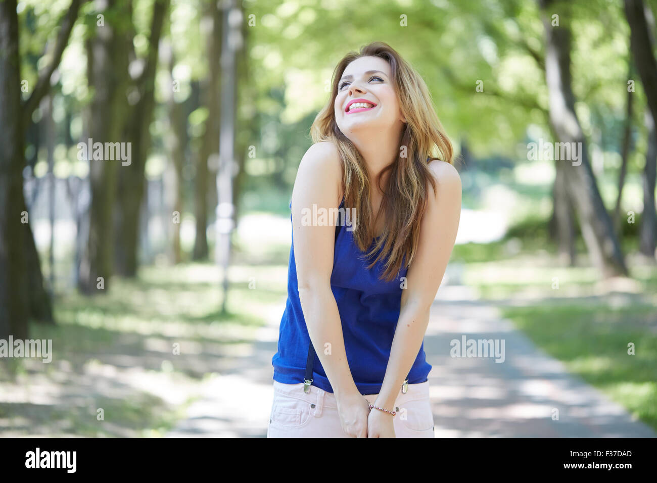 beautiful girl in a park smiling Stock Photo - Alamy