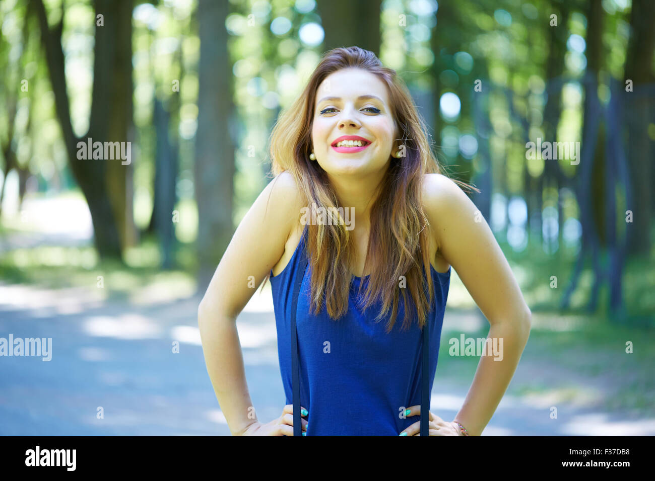 beautiful girl in a park smiling Stock Photo - Alamy