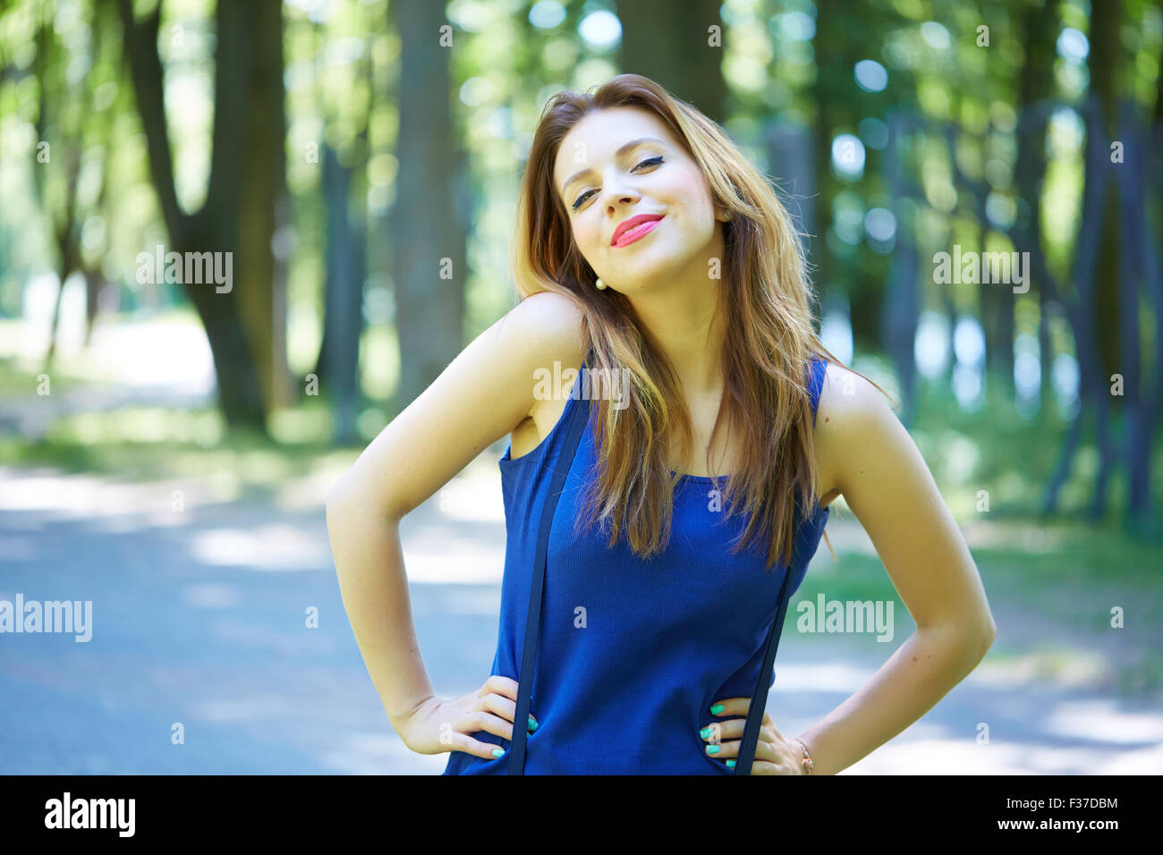 beautiful girl in a park smiling Stock Photo - Alamy