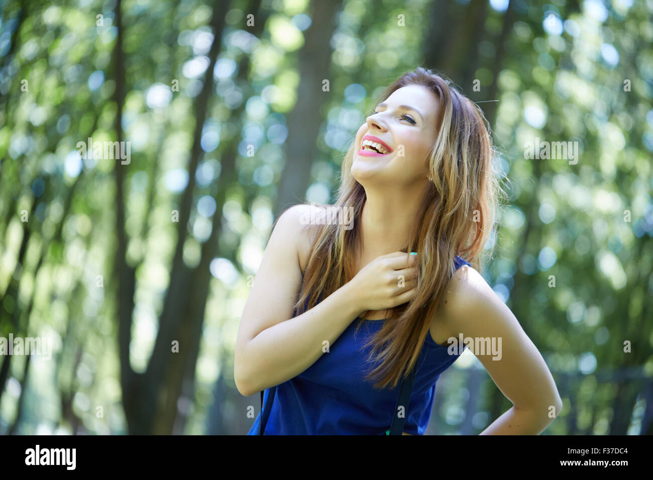 beautiful girl in a park smiling Stock Photo - Alamy