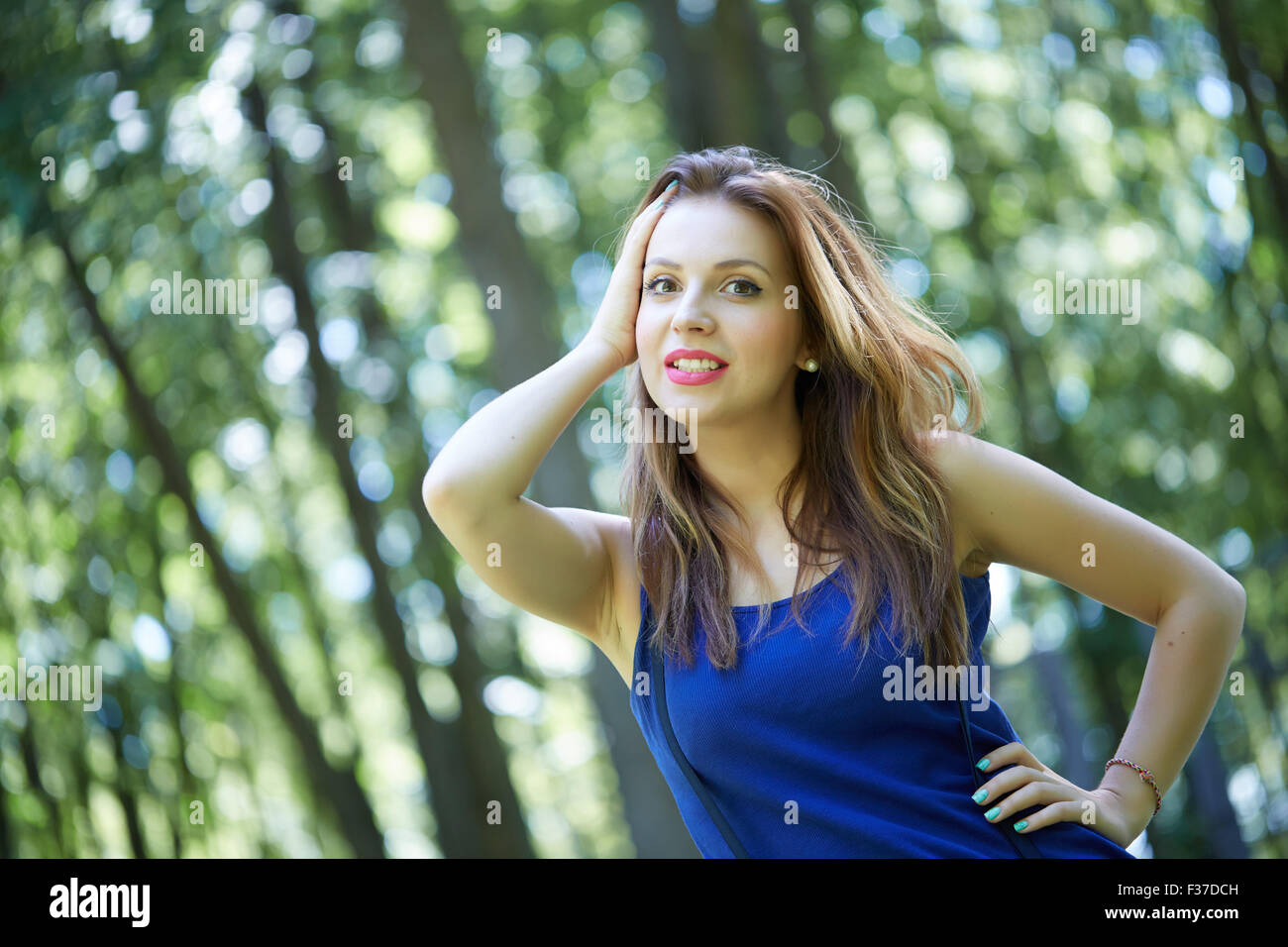 beautiful girl in a park smiling Stock Photo - Alamy