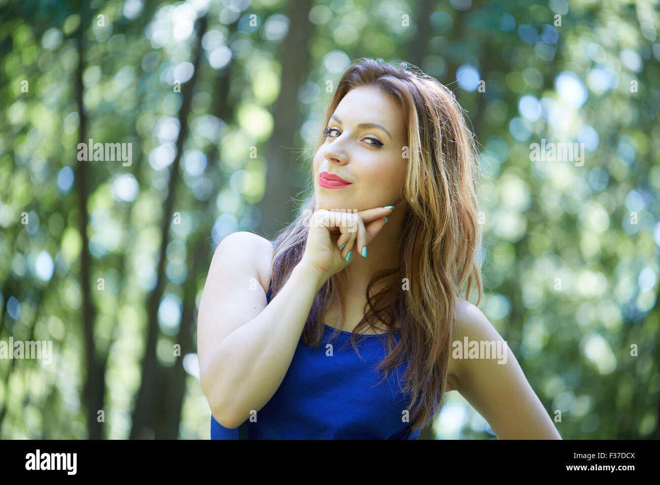 beautiful girl in a park smiling Stock Photo - Alamy